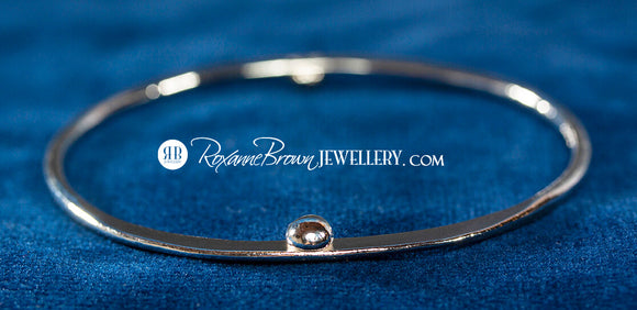 One Ball, Two Balls, It's A Bangle